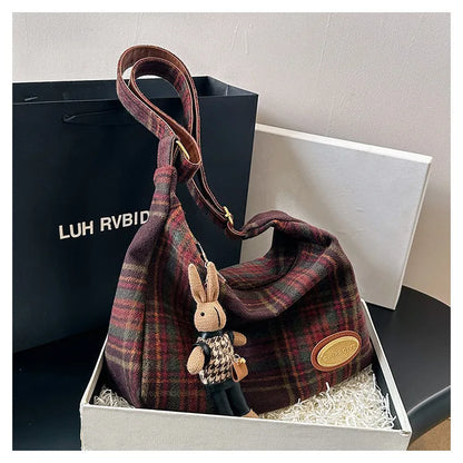Women's large capacity woolen shoulder bag in brown with pendant attachment for autumn and winter use