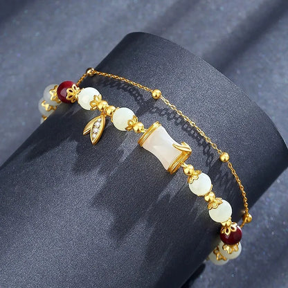 Retro bamboo design bracelet with floral shape and ruyi element in glass and coloured glaze