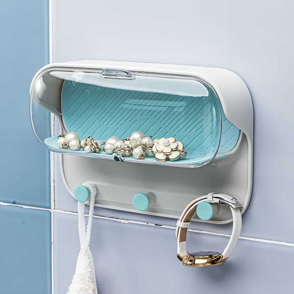 Grey punch-free bathroom storage box mounted on wall with transparent lid showing glasses inside