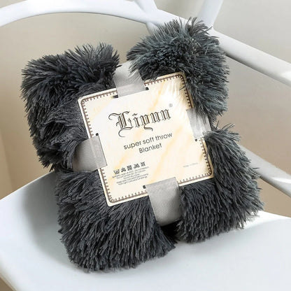Soft coral fleece blanket in various colours and sizes for home and travel comfort