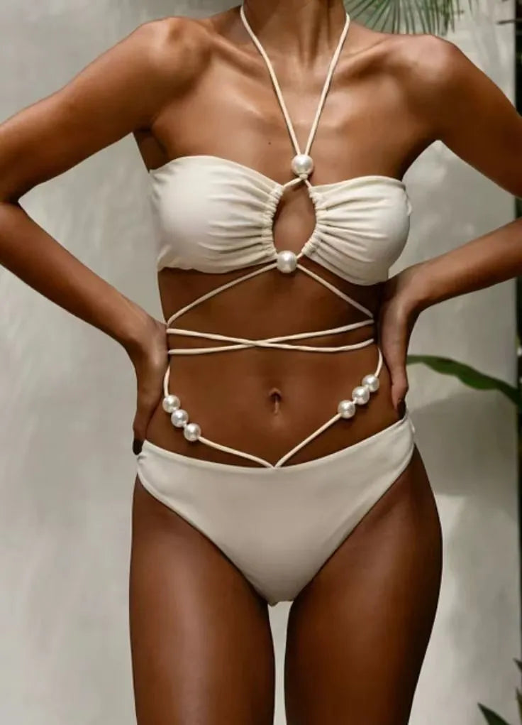 Women's black lace-up bikini swimsuit showing adjustable design and two-piece construction