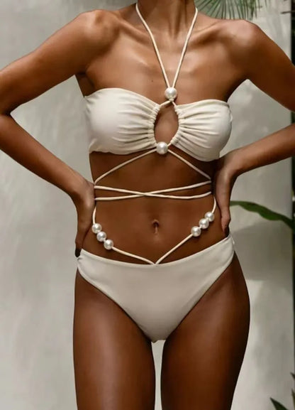 Women's black lace-up bikini swimsuit showing adjustable design and two-piece construction