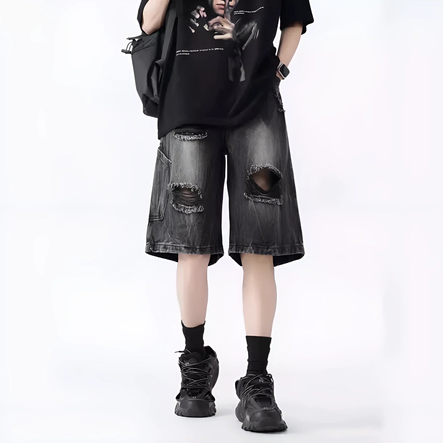 Mens loose fit ripped denim shorts in washed blue and black retro style