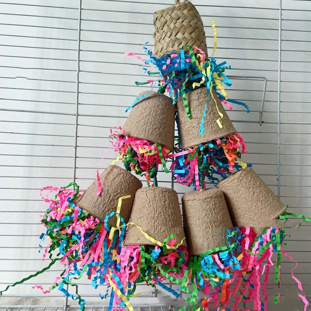 Natural palm leaf parrot chewing toy hanging with woven paper cup design.
