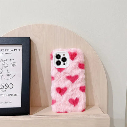 Pink silicone iPhone case with a cartoon design on the back