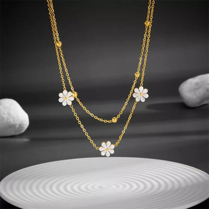 Stainless steel daisy flower jewellery set with necklace, bracelet, and earrings