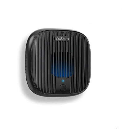 Compact black ultrasonic bed vacuum cleaner for mite repellent on a mattress.