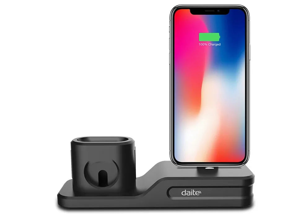 Black silicone 3-in-1 charging stand for Apple iPhone, Apple Watch, and AirPods on a desk