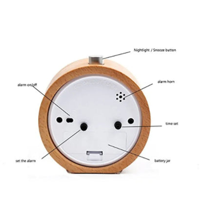 Solid beech wood analog alarm clock with silent snooze on a wooden bedside table