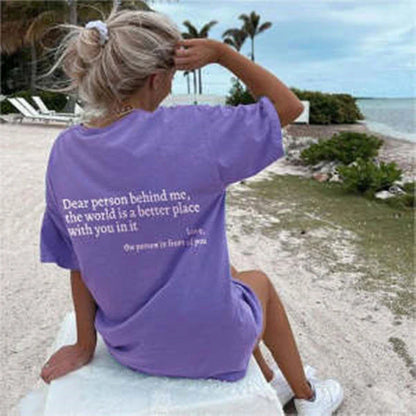 Stylish women's graphic t-shirt with trendy slogan, featuring a vibrant print design and comfortable short sleeve silhouette.