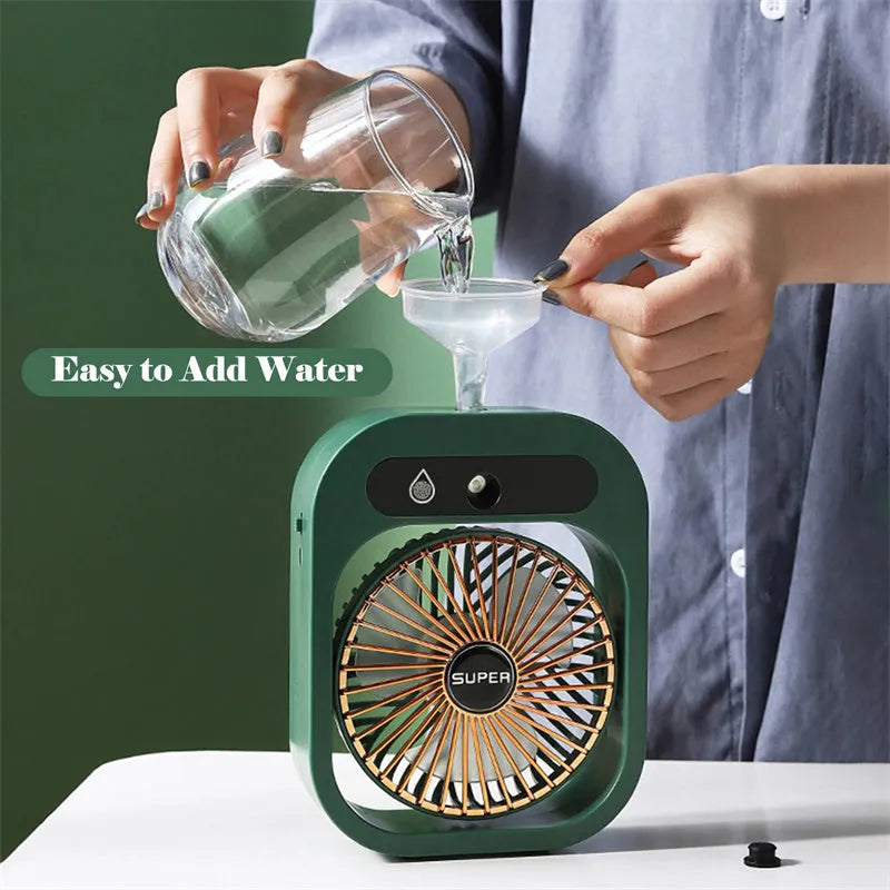 Green and white USB rechargeable misting fan humidifier with adjustable head on a desk