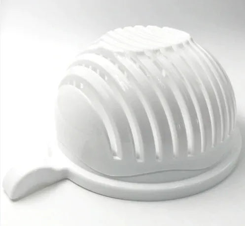 Blue salad cutter bowl showing cutting lid with seams, drain basket function, and reversible base plate