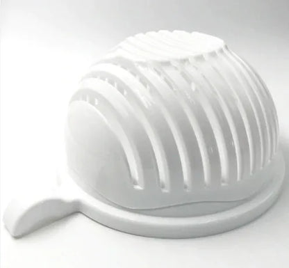 Blue salad cutter bowl showing cutting lid with seams, drain basket function, and reversible base plate