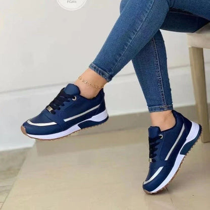 Stylish lace-up sneakers with synthetic leather upper, round toe, and rubber sole for comfortable everyday wear