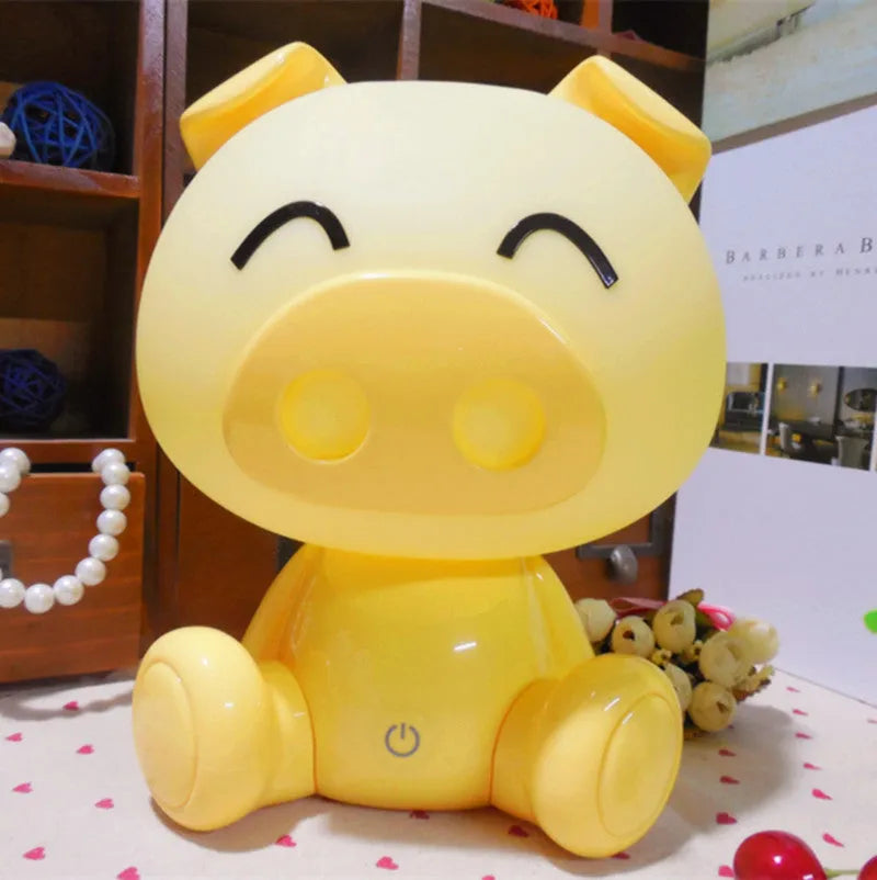 Cartoon pig small night lamp in ABS with 3W power, USB cable, power adapter, and blue, pink or yellow colour options.
