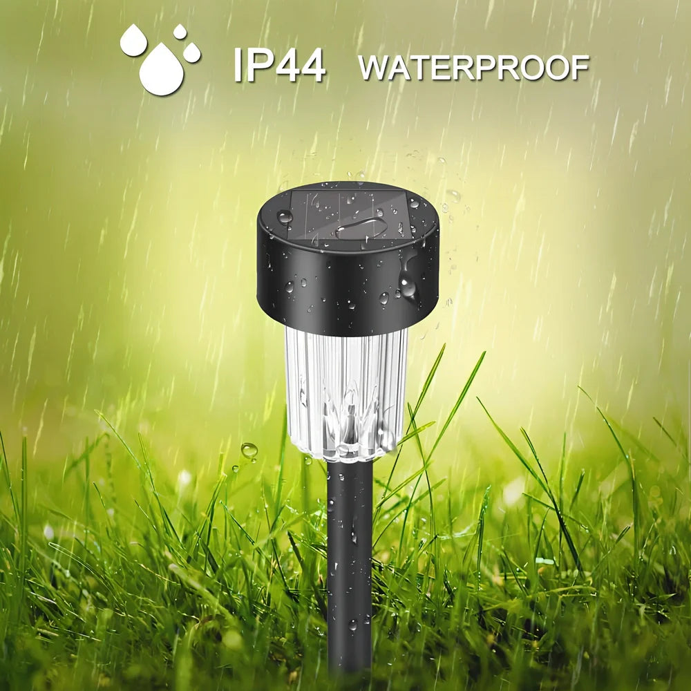 Solar lawn light with LED illumination in garden setting, measuring 55mm by 55mm by 350mm
