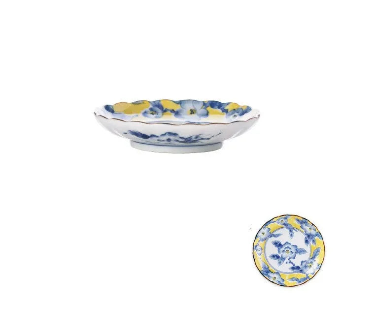 Yellow ceramic tableware set with colourful floral patterns, includes bowls and plates in Japanese style