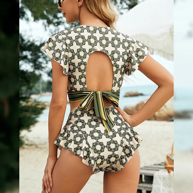 Green flounced backless bikini swimsuit with lace-up V-neck detail and matching shorts