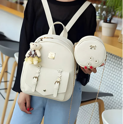Women's black PU leather backpack, shoulder bag, and card bag set with flower designs.