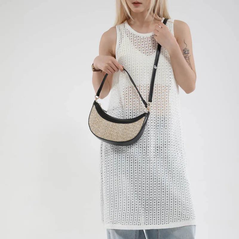 Women's straw crossbody dumpling bag in dumpling shape with contrast stitching details