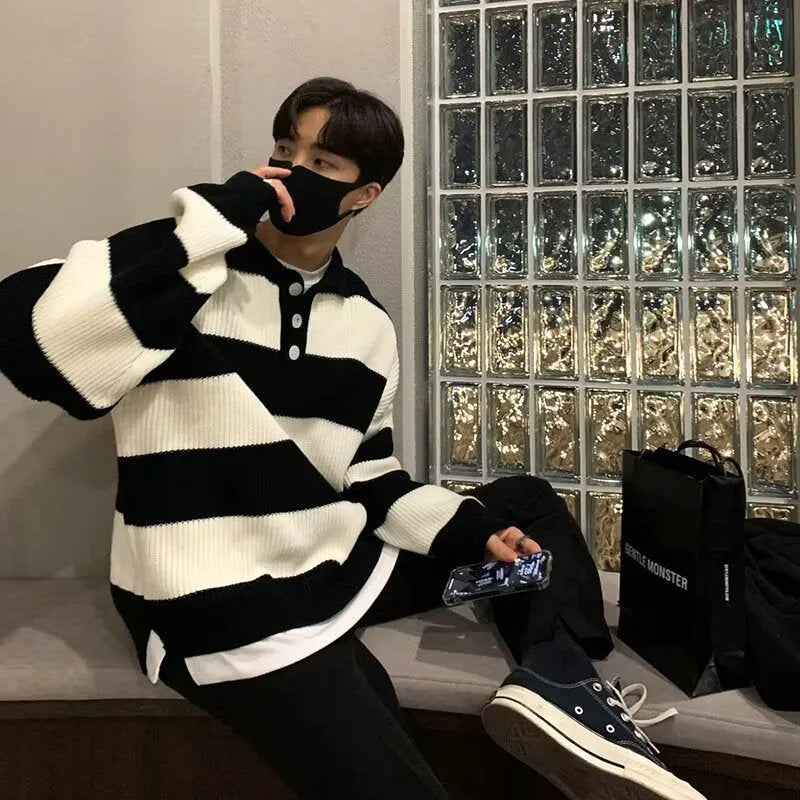 Men's loose pullover sweater in a striped design with long sleeves, constructed from polyester fibre, available in black or grey colour options, suitable for casual wear in sizes M, L, XL, and 2XL. This coat sweater is an all-matching wardrobe staple.