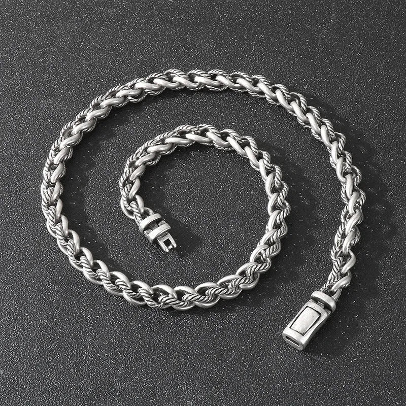 Men's antique silver titanium steel keel chain necklace with large geometric links on a black background.
