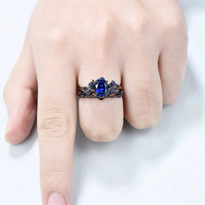 Geometric black women's couple ring with navy blue rhinestone inlay showing side profile