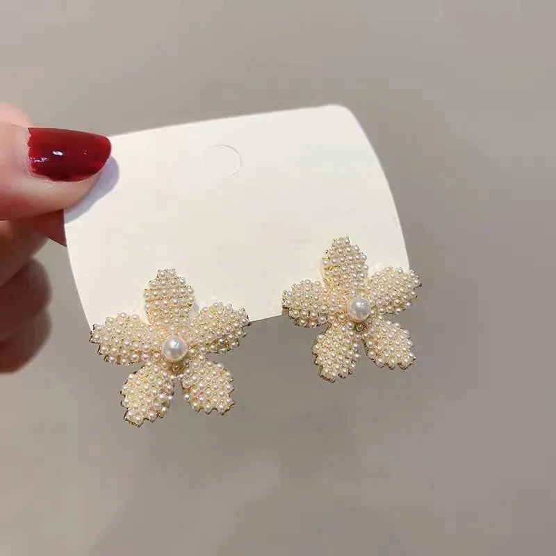 Korean style pineapple and starfish motif earrings with pearl accents in gold, silver, pearl flower, or starfish pearl finish.