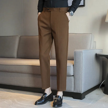 Straight-leg brown corduroy trousers with elastic waistband on size chart