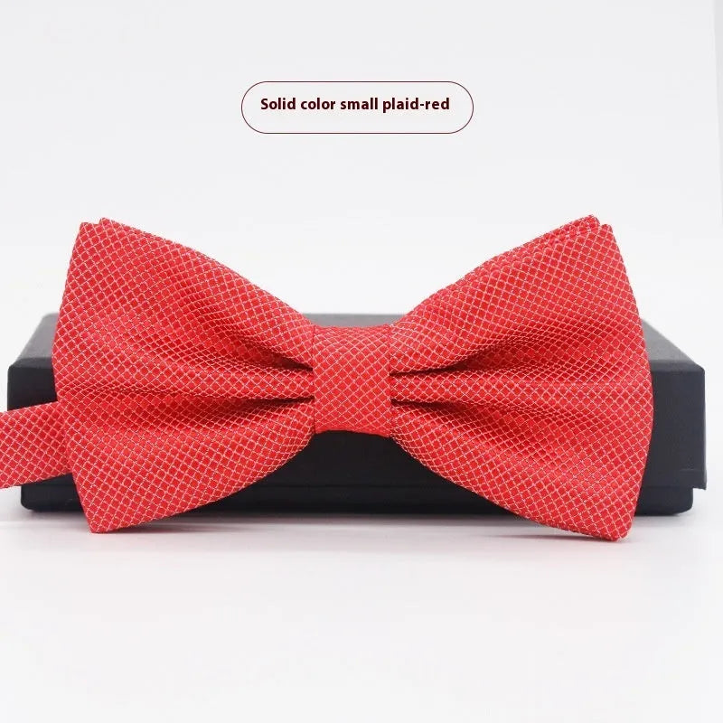 A solid colour pre-tied bow tie with an adjustable neck strap, shown in a classic flat head shape.