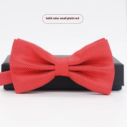 A solid colour pre-tied bow tie with an adjustable neck strap, shown in a classic flat head shape.