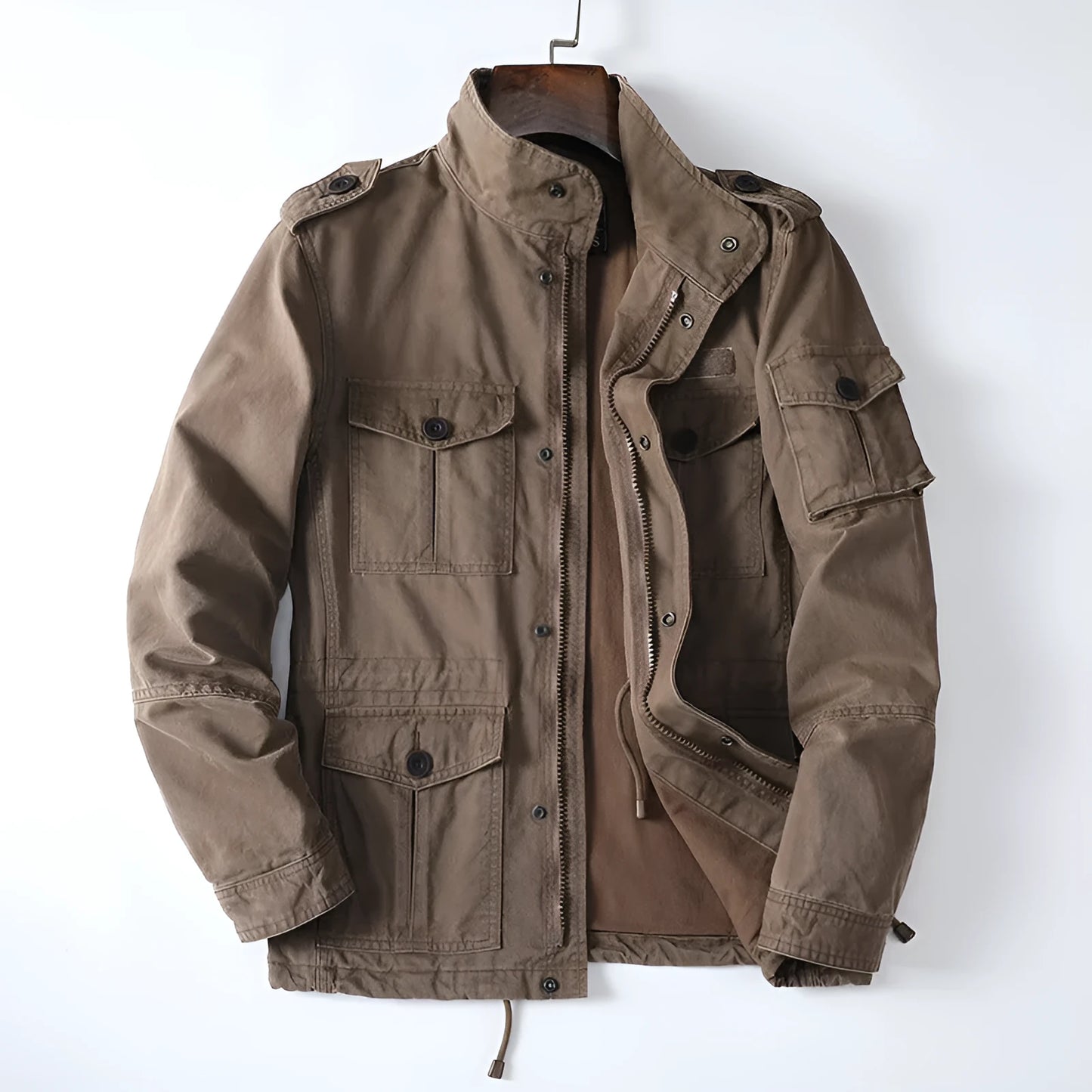 Men's loose-fit cotton zip jacket in light brown colour on a hanger, showing stand collar and front zip.