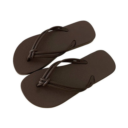 Men's PVC toe-covering flip-flop slippers on a white background, showing the injection moulded sole and available colour options.