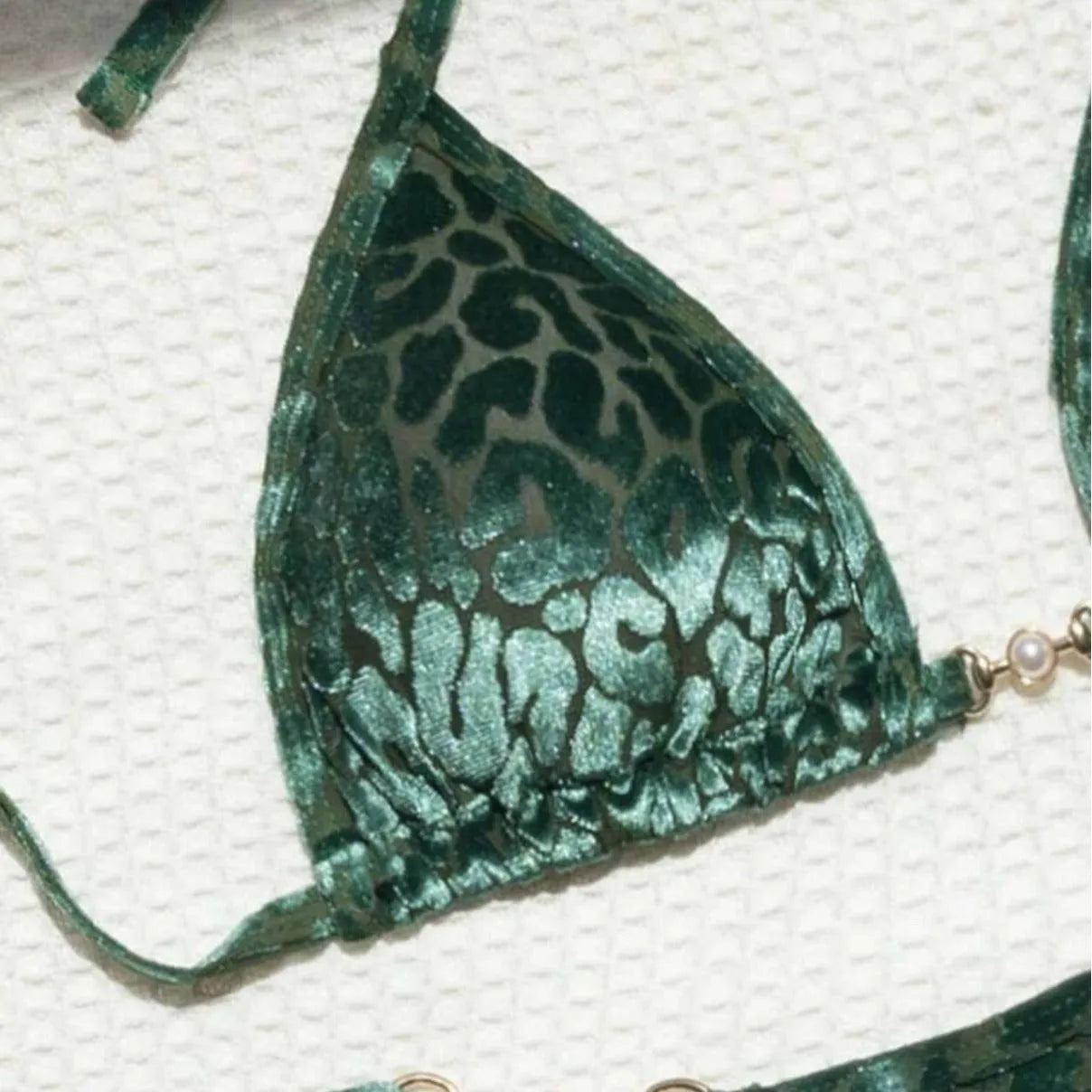 Women's leopard print bikini swimsuit set in various colours including blue and green, shown in triangle and skirt styles.