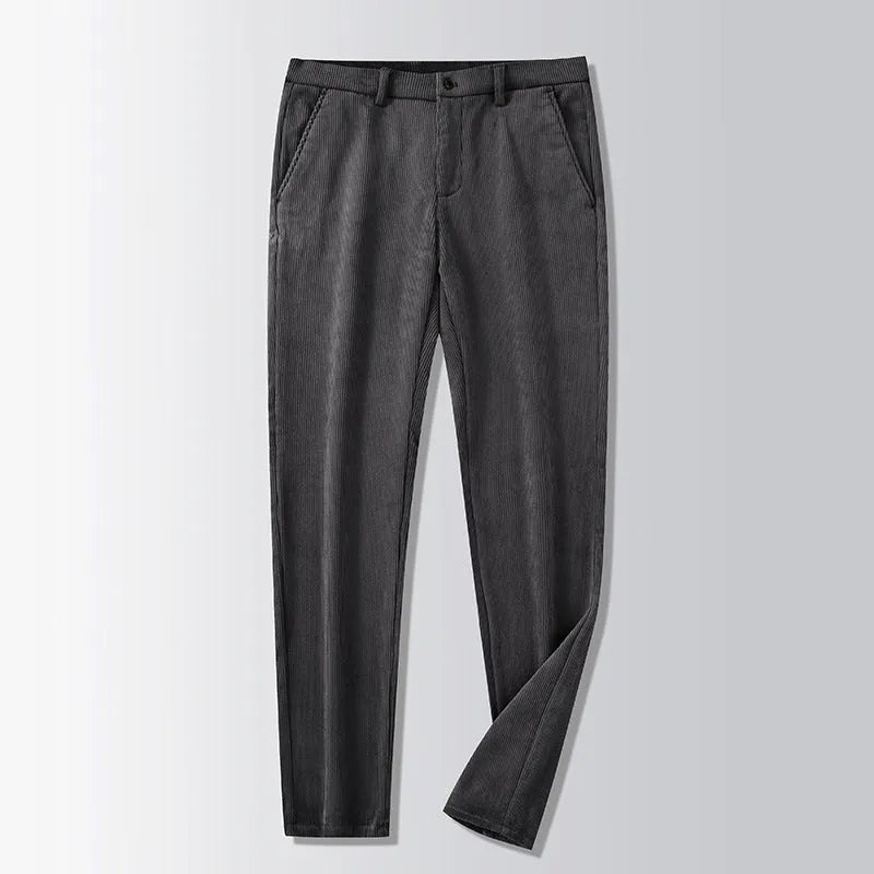 Man wearing khaki and black striped straight-leg retro trousers with a zip fly.