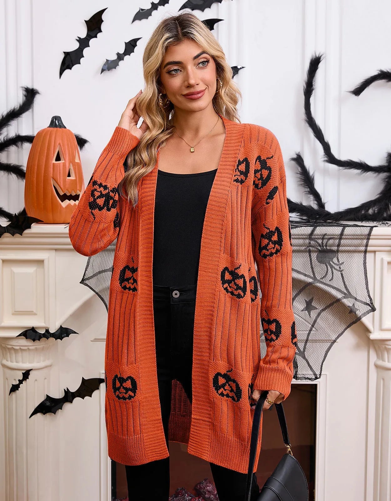 Women's black Halloween cardigan with orange pumpkin head jacquard pattern, regular sleeves, medium 65cm length