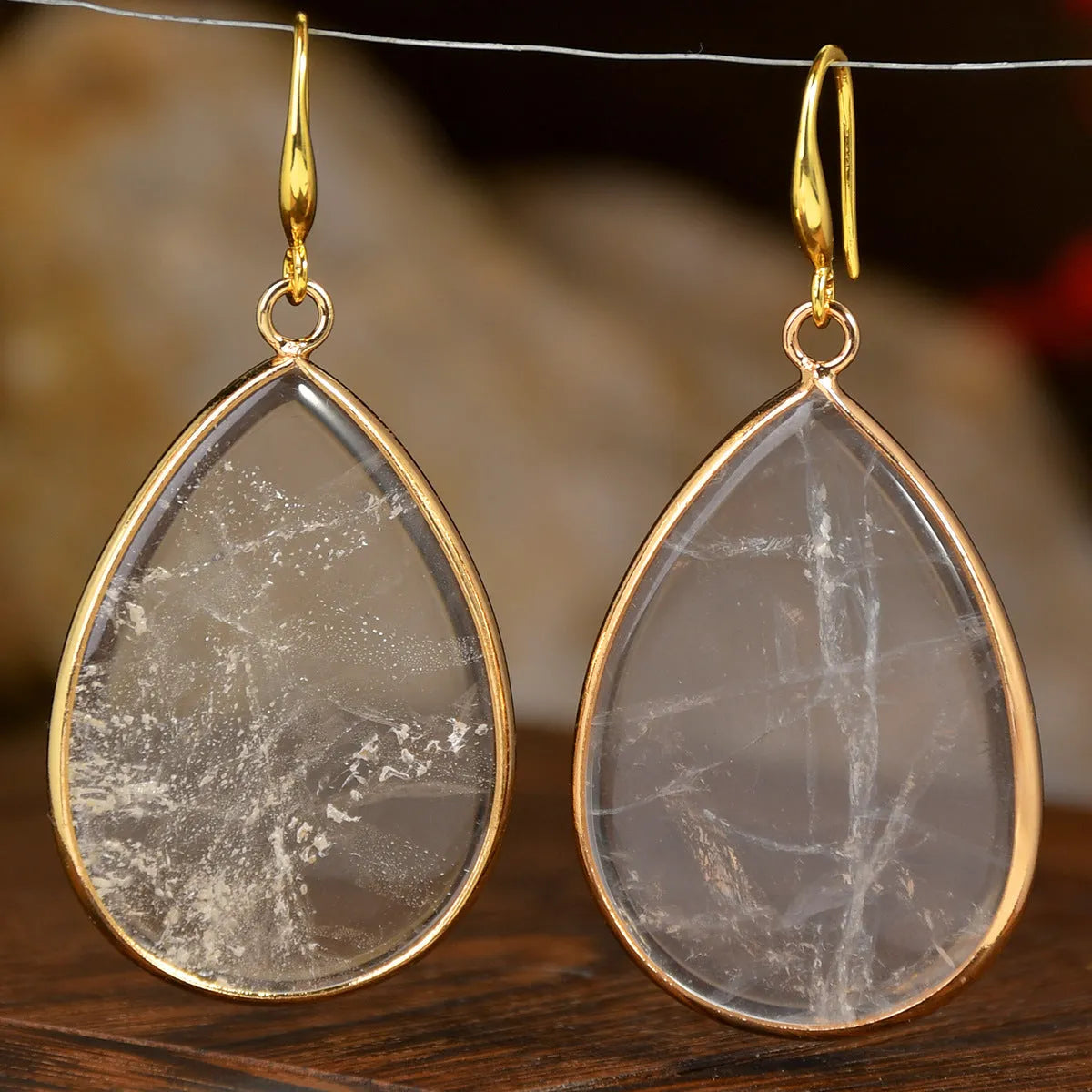 Women's retro-style drop earrings with a natural stone pendant in a water drop shape on an electroplated setting.