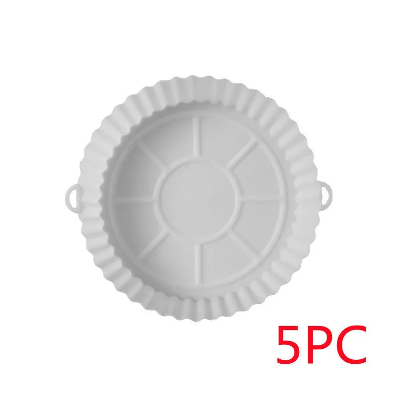 Round blue silicone baking tray mat with 4.5cm sides on a kitchen counter.