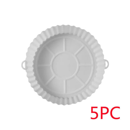 Round blue silicone baking tray mat with 4.5cm sides on a kitchen counter.