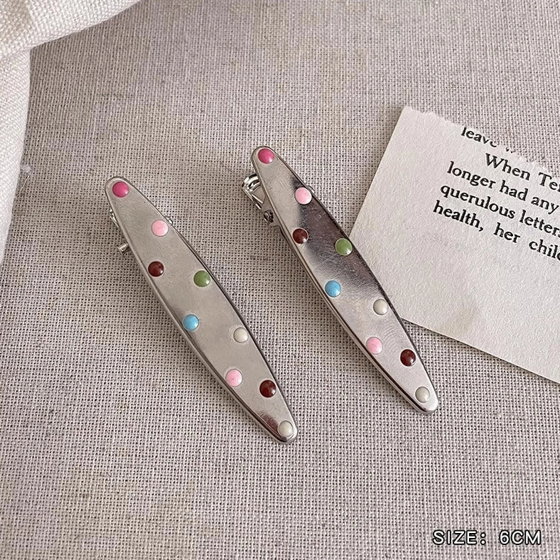 Silver metal hair barrettes with hollow heart pattern and duckbill clip design