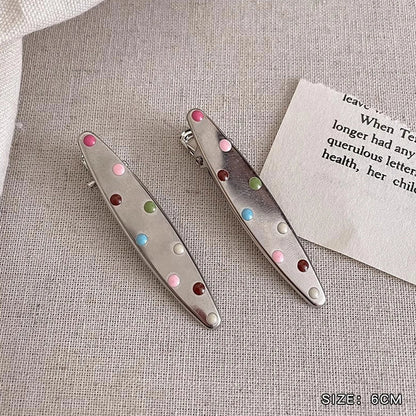 Silver metal hair barrettes with hollow heart pattern and duckbill clip design