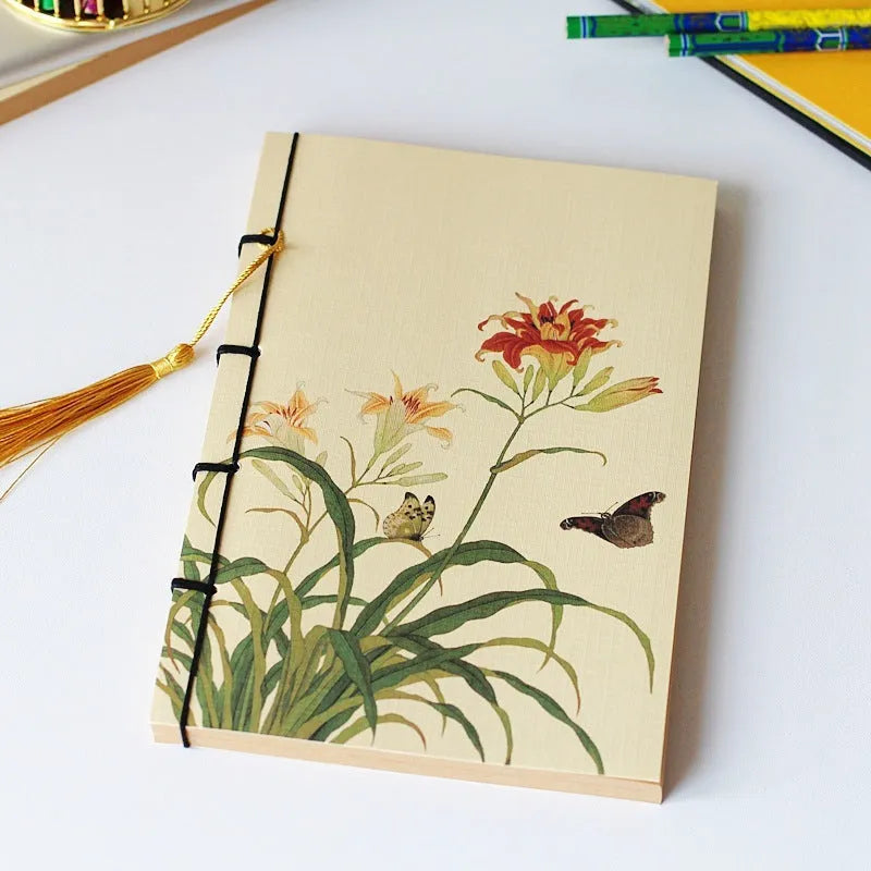 A5 antique wire-bound notebook with classical artwork cover, black oil wax rope binding, and decorative tassels