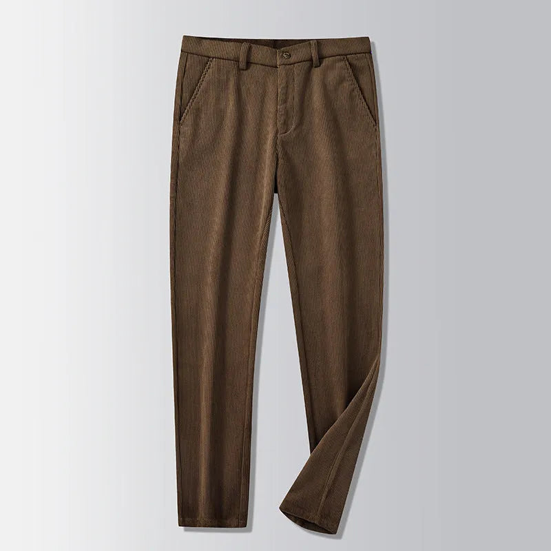 Man wearing khaki and black striped straight-leg retro trousers with a zip fly.