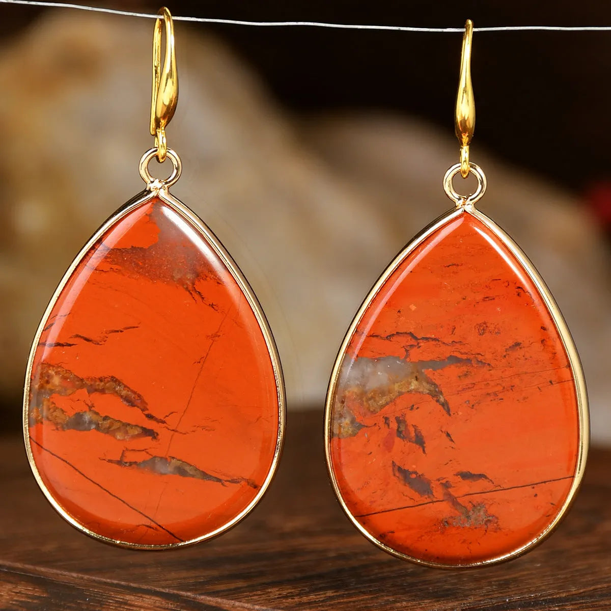 Women's retro-style drop earrings with a natural stone pendant in a water drop shape on an electroplated setting.