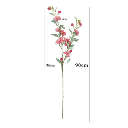 Artificial silk camellia flower in a vase, colours include white, pink, rose pink, and orange coffee.