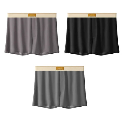 Pack of three pairs of solid colour men's ice silk briefs on a white background