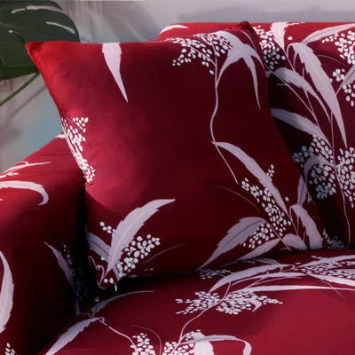 Printed stretchable sofa slipcover with geometric abstraction pattern on a three-seater sofa, showing tight fit and modern design.