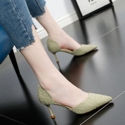 Women's black pointed toe stiletto heel sandals on a white background.