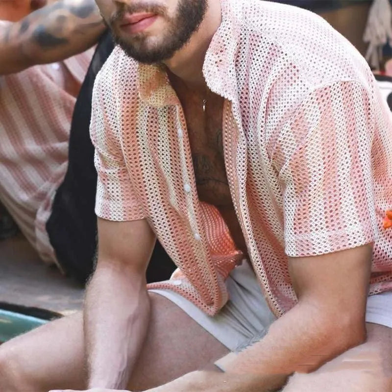 Pink men's short-sleeve waffle-knit shirt with a loose cardigan style on a hanger.