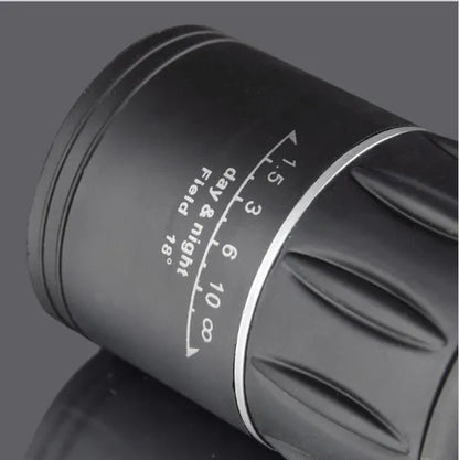 Black 16x52 high-power monocular with roof prism design and green lens coating.